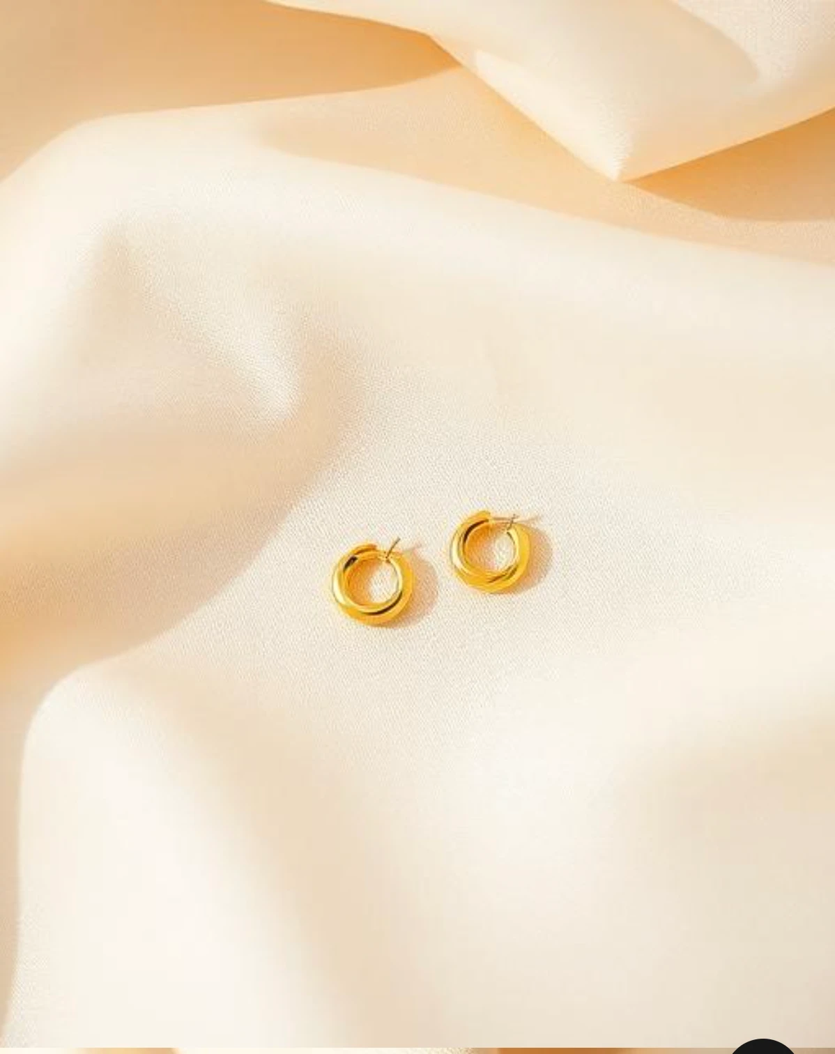 Close-up of a model wearing Orvielle earrings